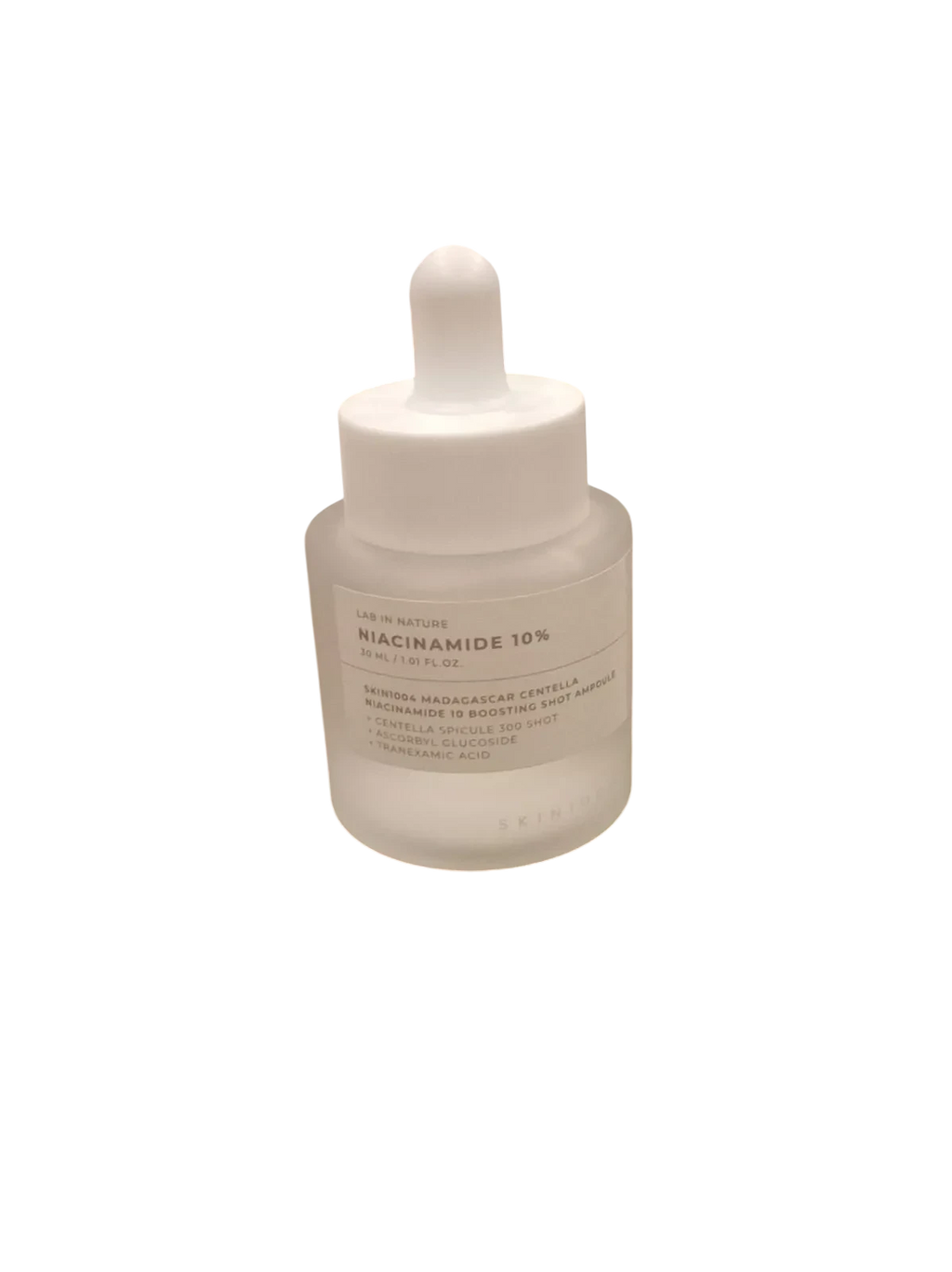Ampolla iluminadora K-Chic Skin SKIN1004 con niacinamida y centella asiática en frasco de vidrio esmerilado de 30 ml