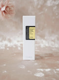 Envase de COSRX Advanced Snail Peptide Eye Cream de K-Chic Skin Especialidad sobre fondo suave y elegante
