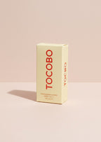 Caja de protector solar en barra TOCOBO Vita Waterproof Sun Stick SPF50+ de K-Chic Skin Especialidad en tono crema