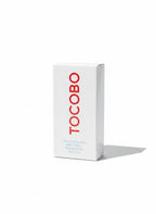 Caja blanca del protector solar en stick TOCOBO Cotton Soft de K-Chic Skin con letras rojas y acabado mate.